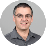 Man wearing glasses and gray shirt